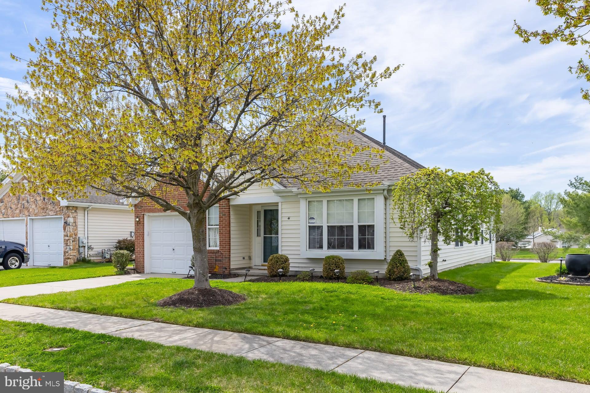 41 Grandview Place Sewell, NJ 08080 - Photo 3 of 23 a front view of a house with a garden and trees