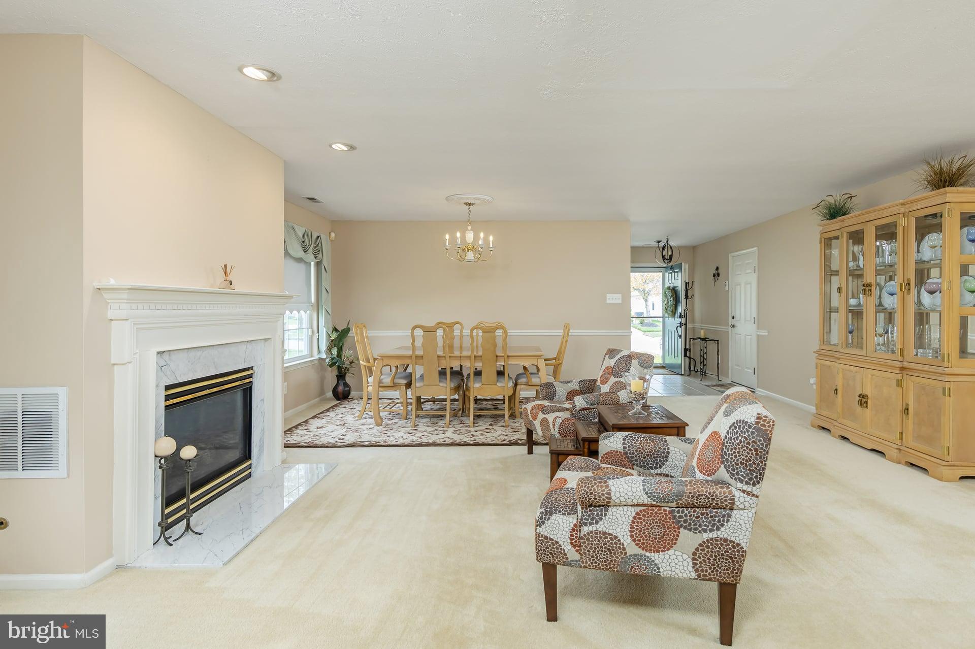 41 Grandview Place Sewell, NJ 08080 - Photo 4 of 23 a living room with furniture a fireplace and a flat screen tv