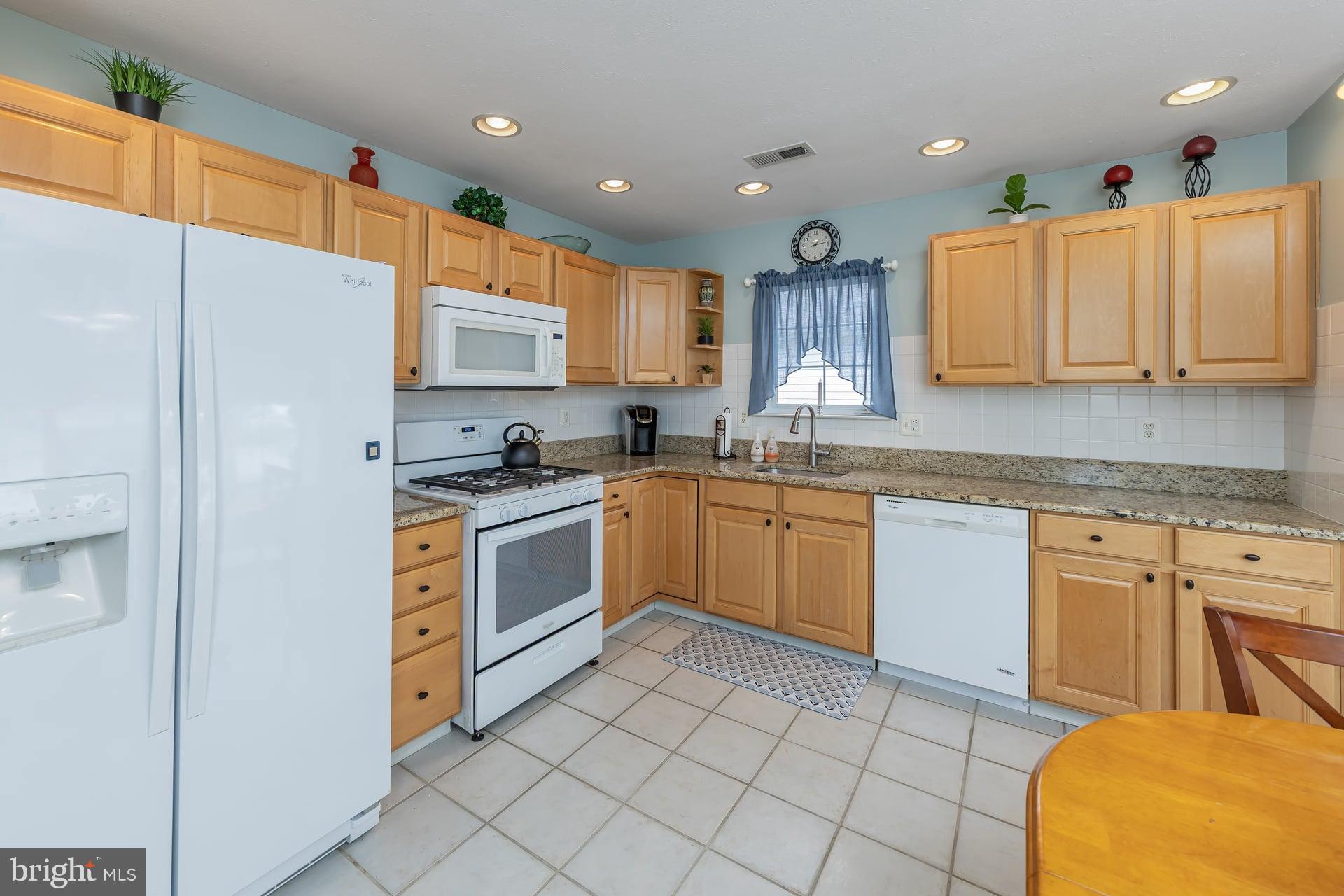 41 Grandview Place Sewell, NJ 08080 - Photo 7 of 23 a kitchen with a sink a counter top space cabinets and stainless steel appliances