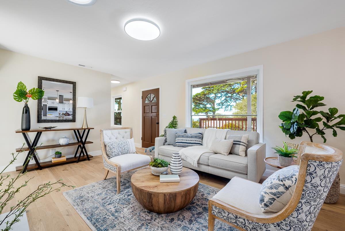 305 Stuart Avenue Pacific Grove, CA 93950 - Photo 11 of 55 a living room with furniture and a large window