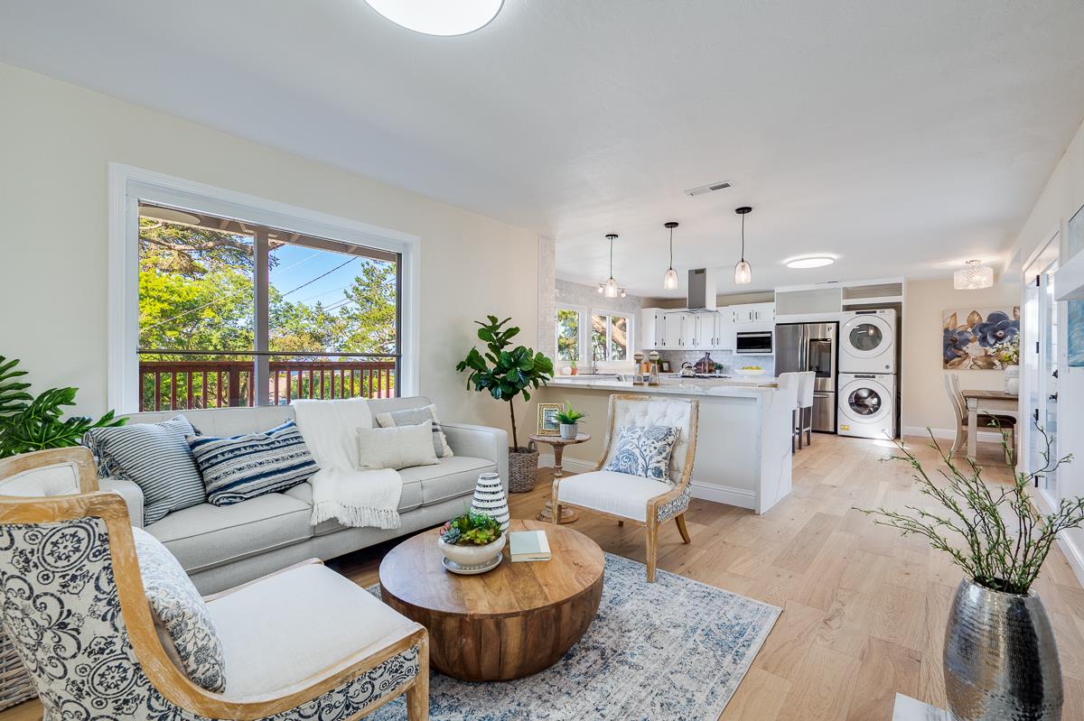 305 Stuart Avenue Pacific Grove, CA 93950 - Photo 12 of 55 a living room with furniture and a large window