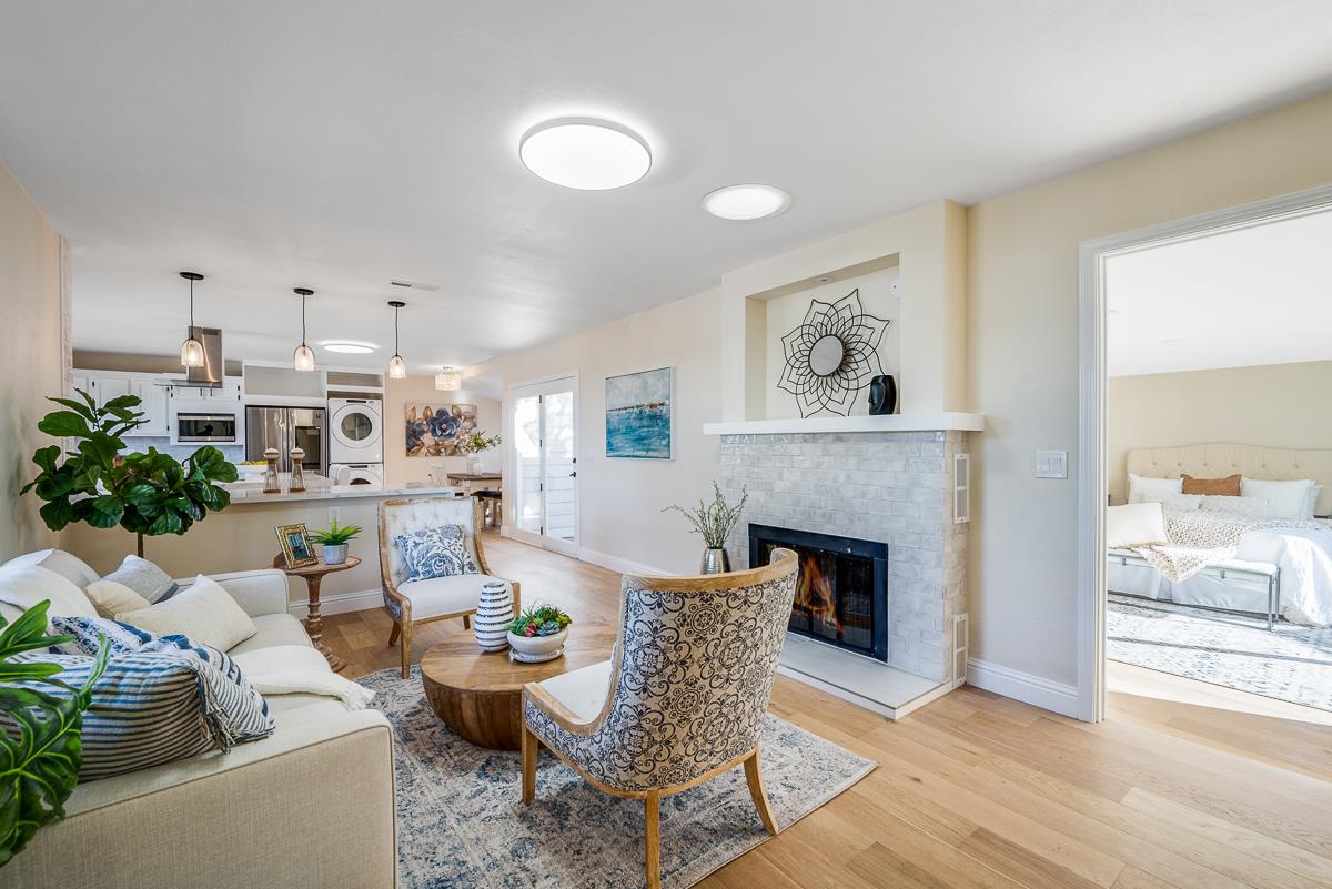 305 Stuart Avenue Pacific Grove, CA 93950 - Photo 13 of 55 a living room with furniture and a fireplace