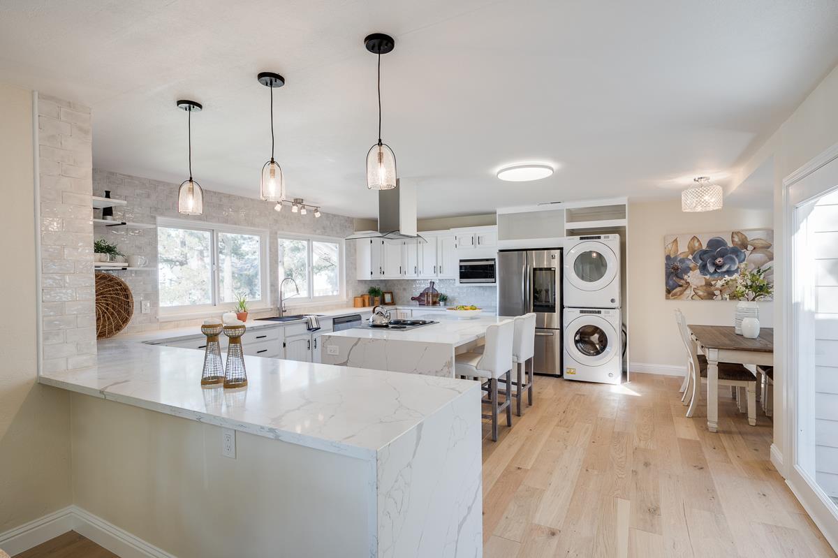 305 Stuart Avenue Pacific Grove, CA 93950 - Photo 14 of 55 a large kitchen with a large counter top appliances and cabinets