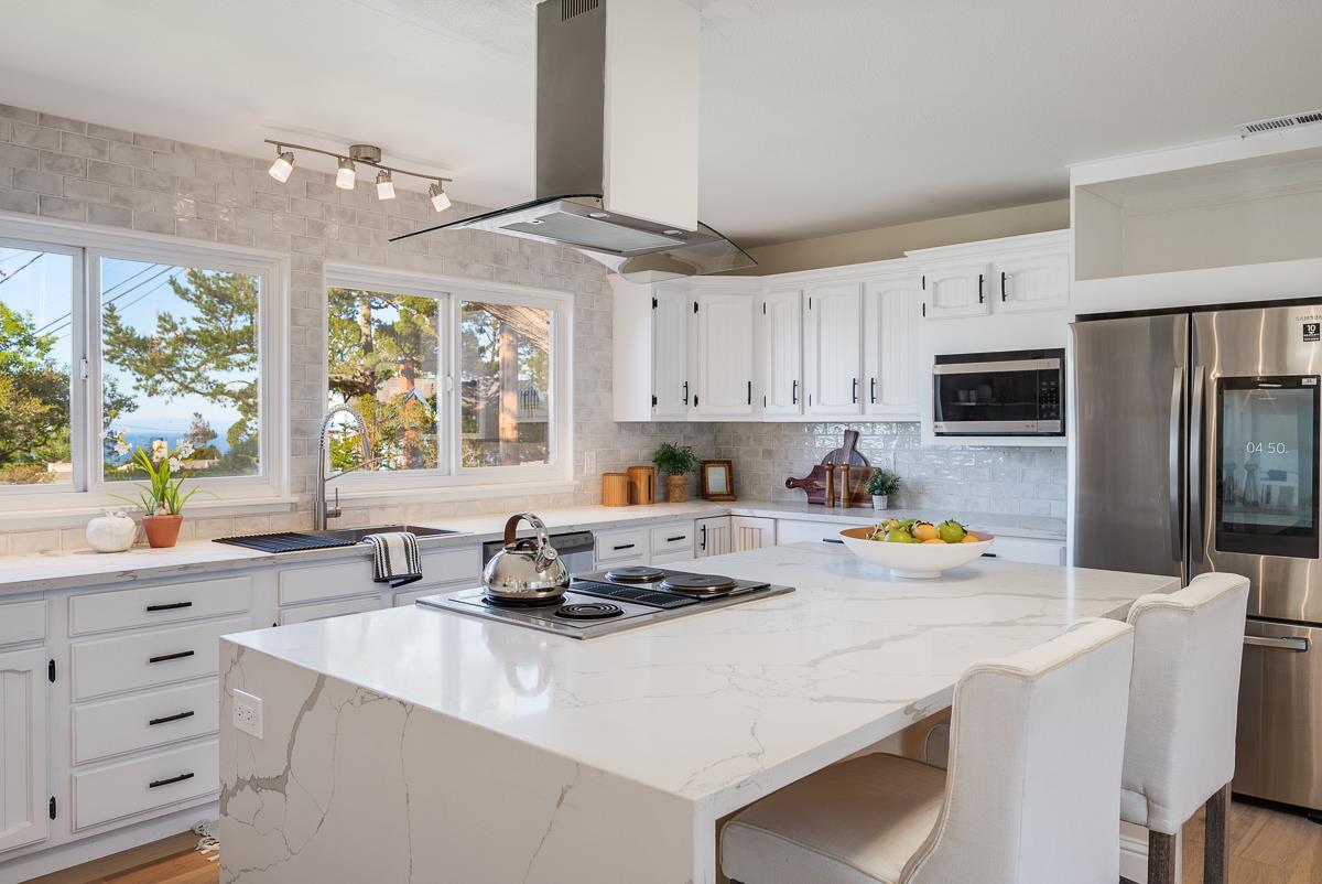 305 Stuart Avenue Pacific Grove, CA 93950 - Photo 18 of 55 a kitchen with a refrigerator a stove a sink and a refrigerator