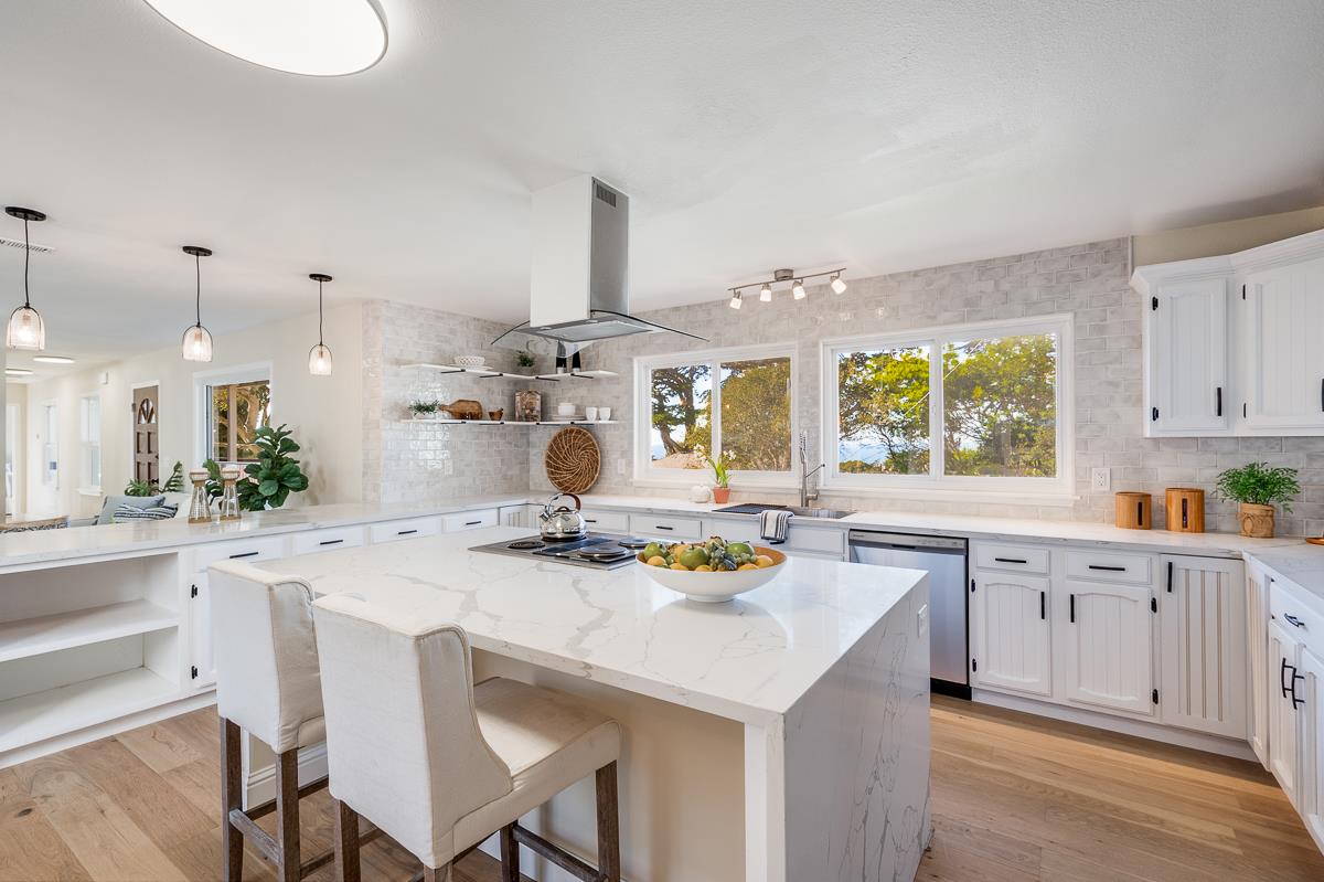 305 Stuart Avenue Pacific Grove, CA 93950 - Photo 22 of 55 a kitchen with stainless steel appliances a sink a stove and a refrigerator