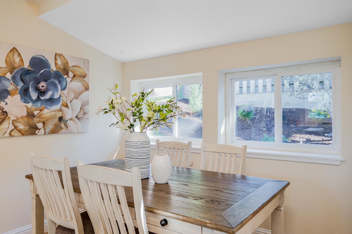 305 Stuart Avenue Pacific Grove, CA 93950 - Photo 23 of 55 a view of a dining room with furniture and a potted plant