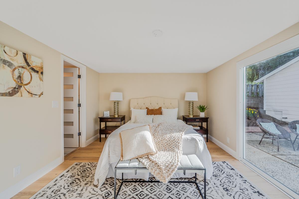 305 Stuart Avenue Pacific Grove, CA 93950 - Photo 25 of 55 a bed room with a bed and a couch