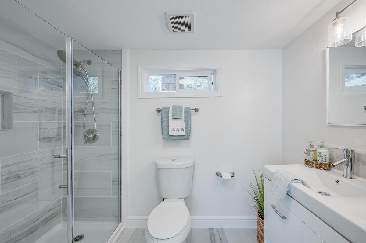305 Stuart Avenue Pacific Grove, CA 93950 - Photo 28 of 55 a bathroom with a toilet sink and shower