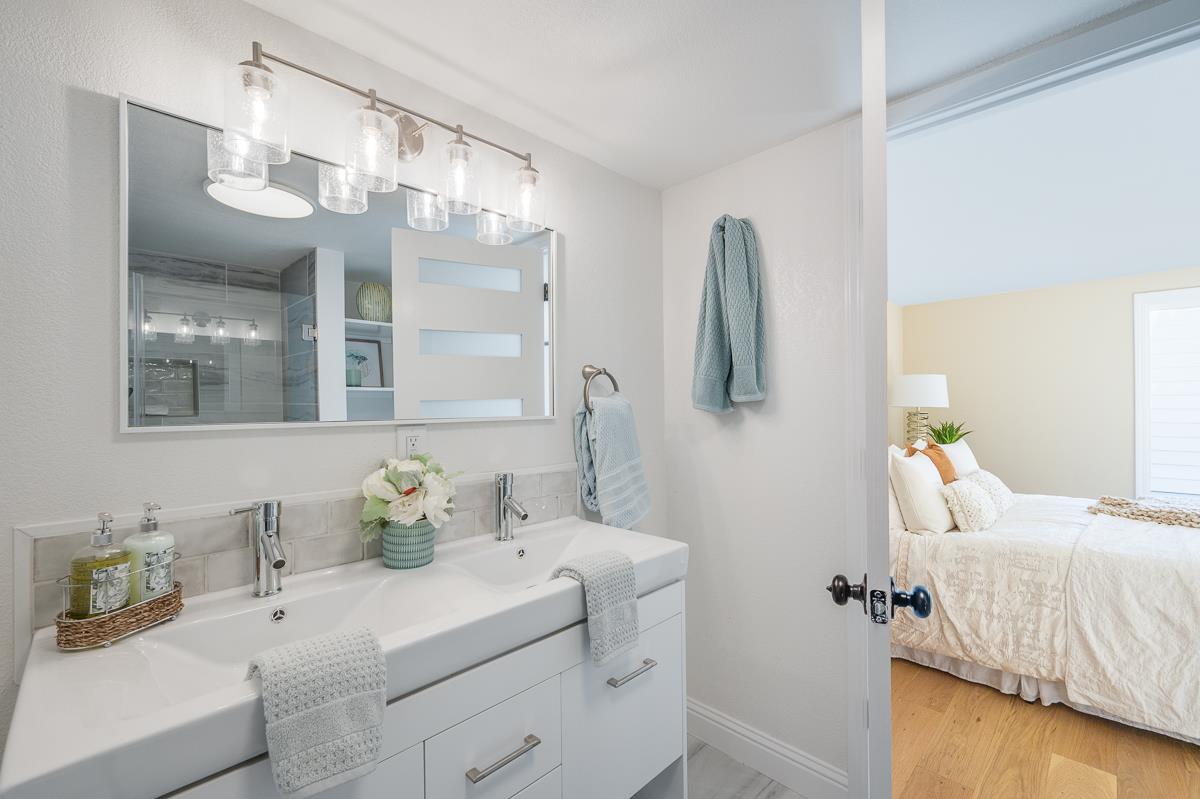 305 Stuart Avenue Pacific Grove, CA 93950 - Photo 29 of 55 a bathroom with a sink and a mirror