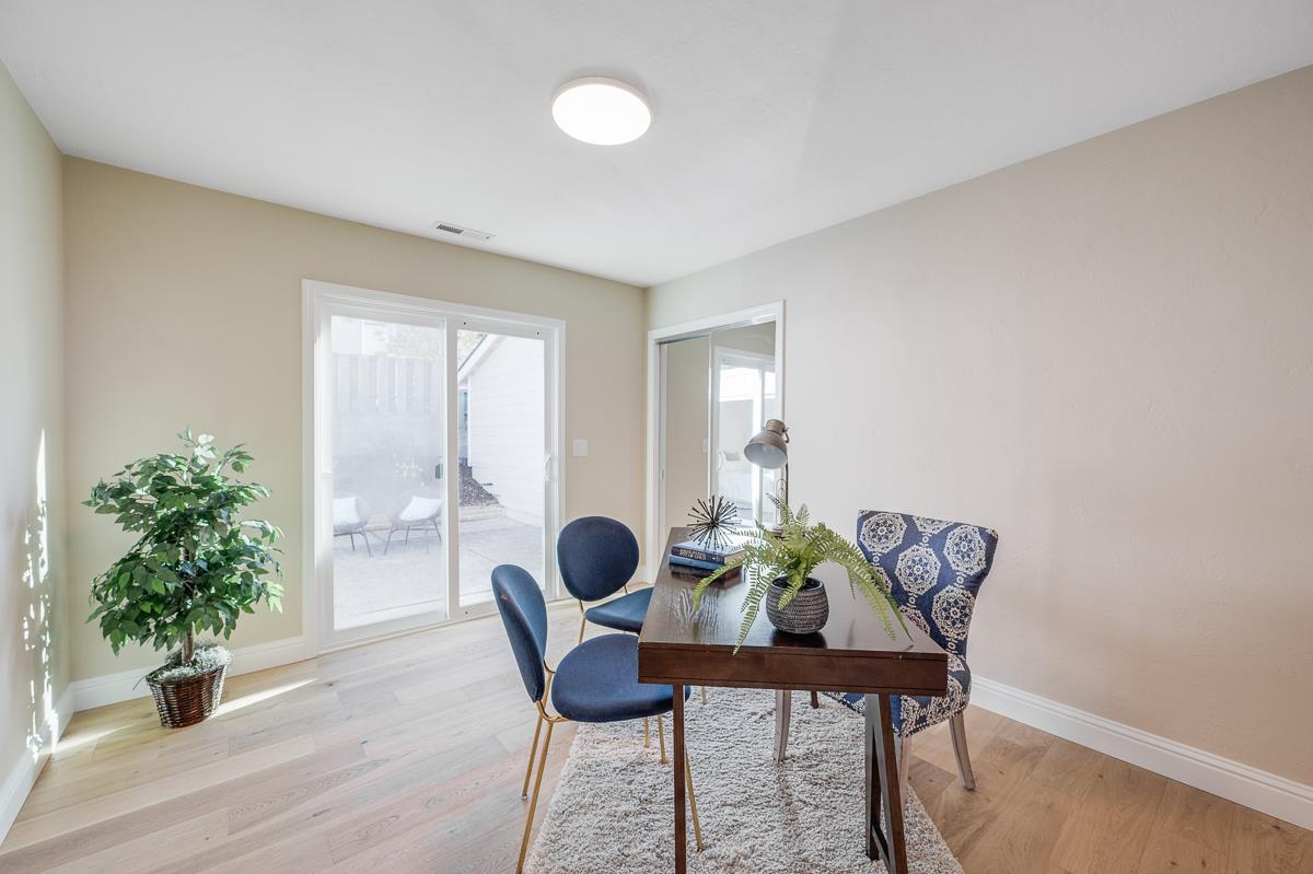 305 Stuart Avenue Pacific Grove, CA 93950 - Photo 31 of 55 a view of a dining room with furniture window and wooden floor
