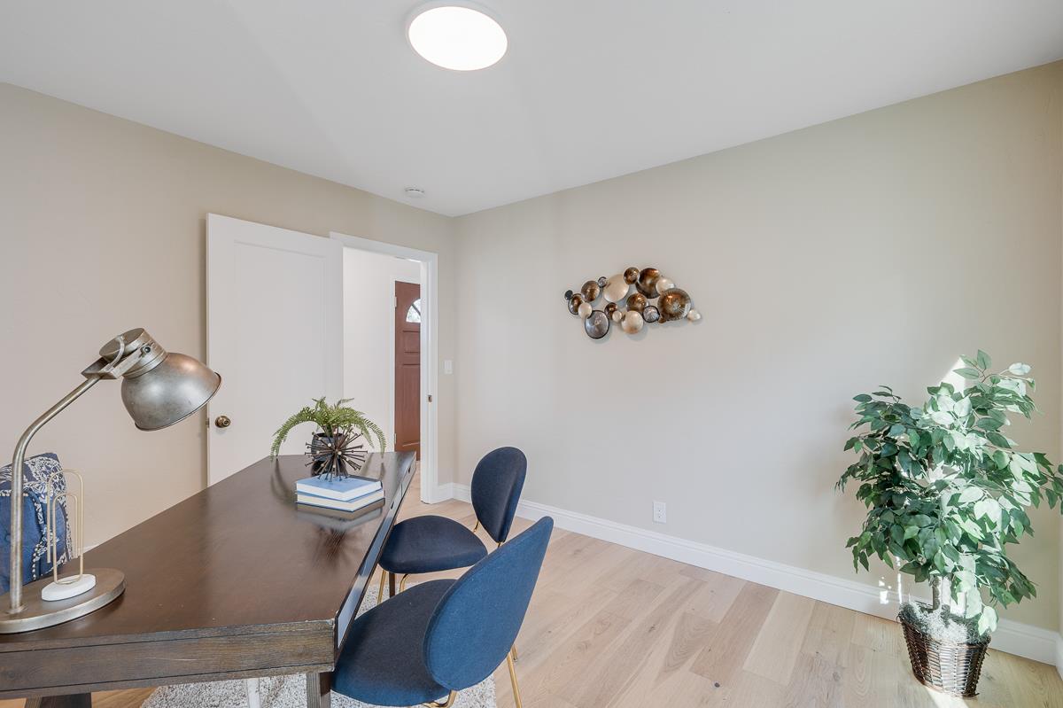 305 Stuart Avenue Pacific Grove, CA 93950 - Photo 32 of 55 a living room with furniture and a potted plant