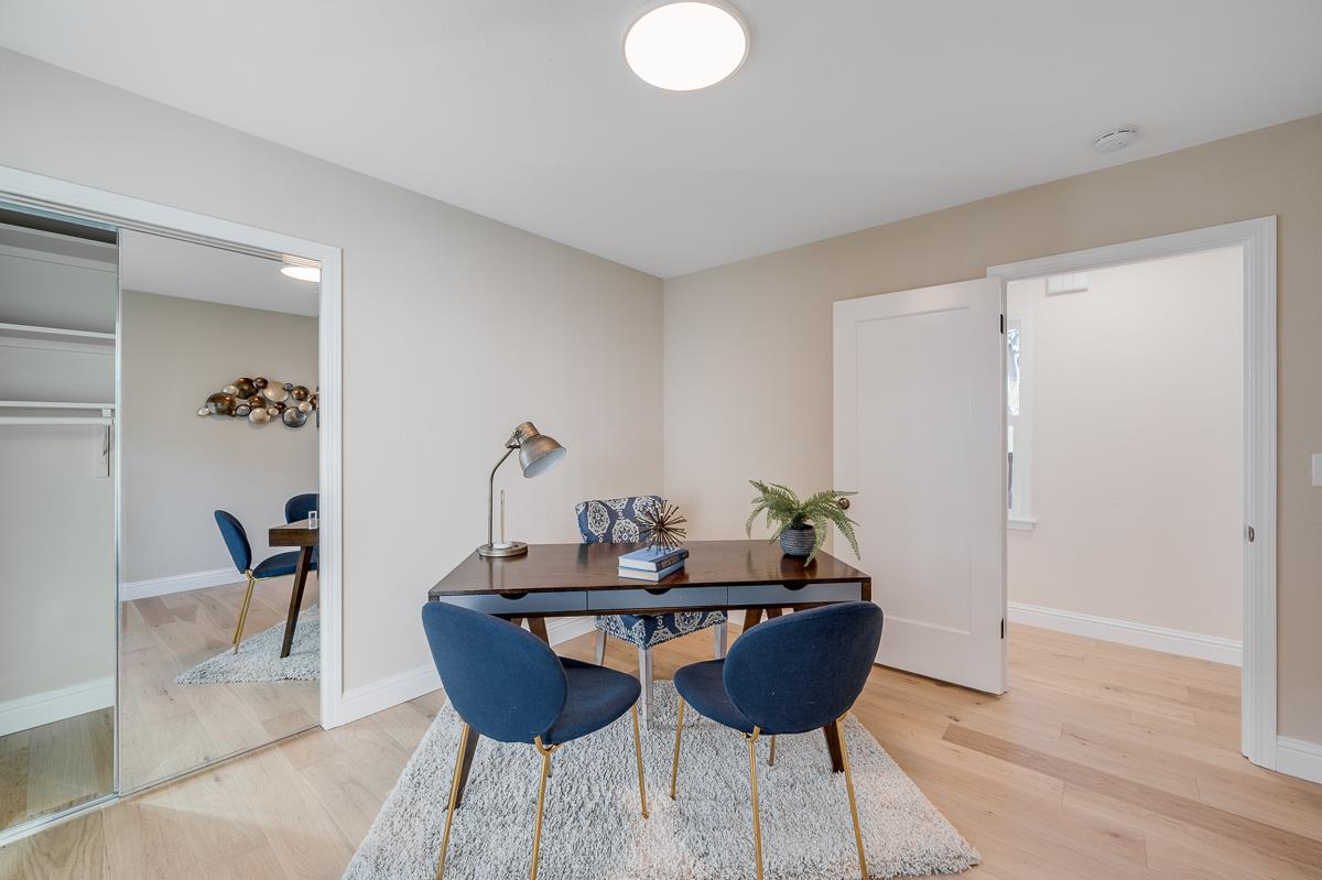 305 Stuart Avenue Pacific Grove, CA 93950 - Photo 33 of 55 a dining room with furniture and wooden floor