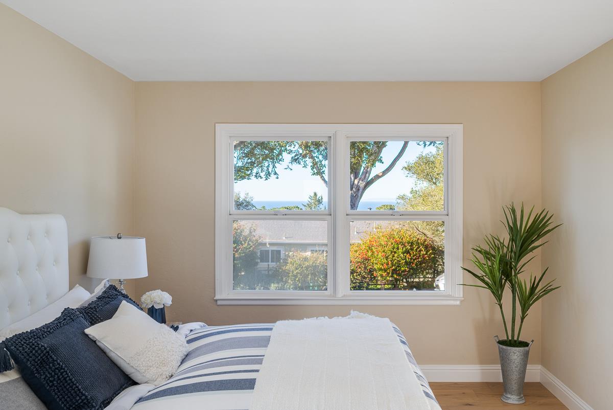 305 Stuart Avenue Pacific Grove, CA 93950 - Photo 35 of 55 a living room with furniture and a large window