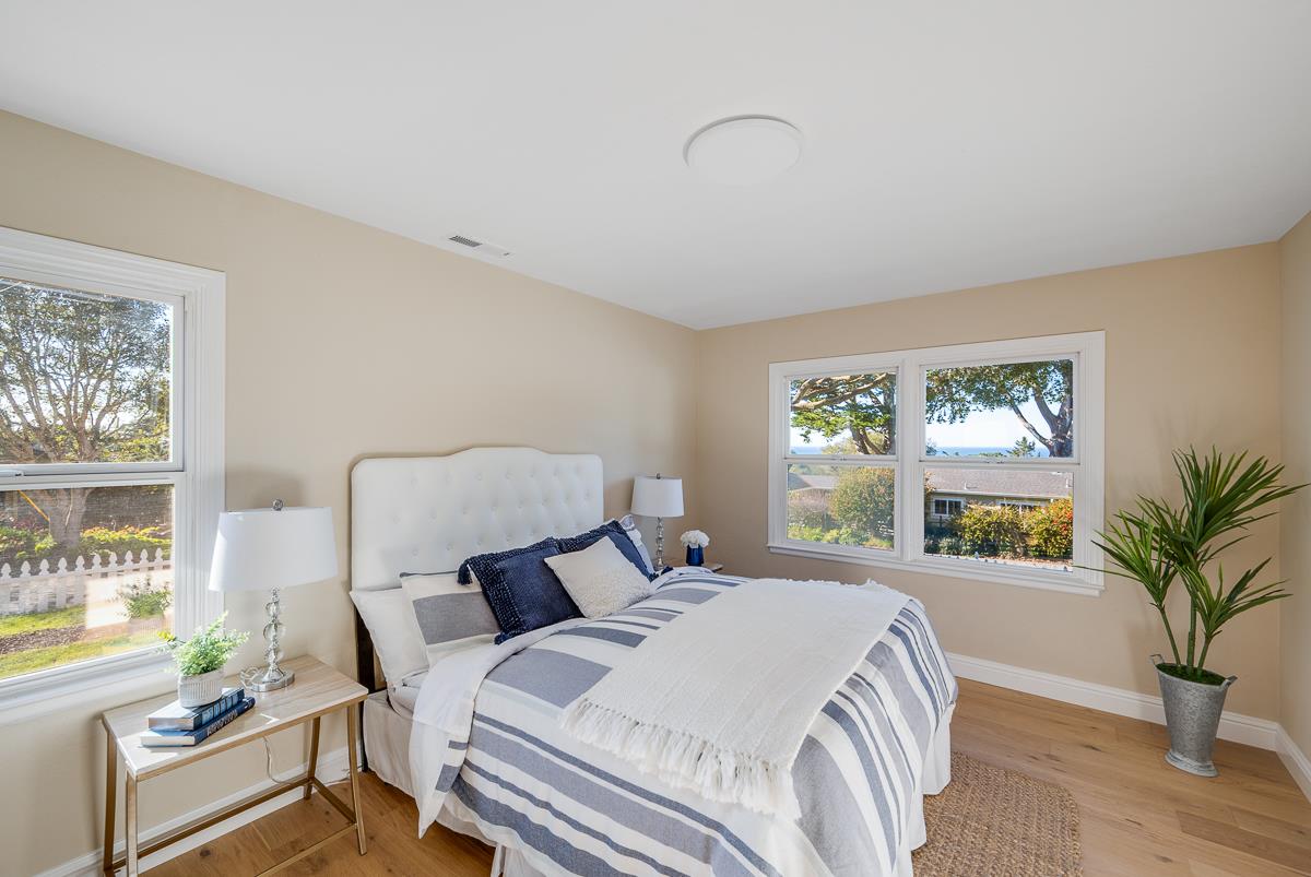 305 Stuart Avenue Pacific Grove, CA 93950 - Photo 37 of 55 a bedroom with bed and a large window