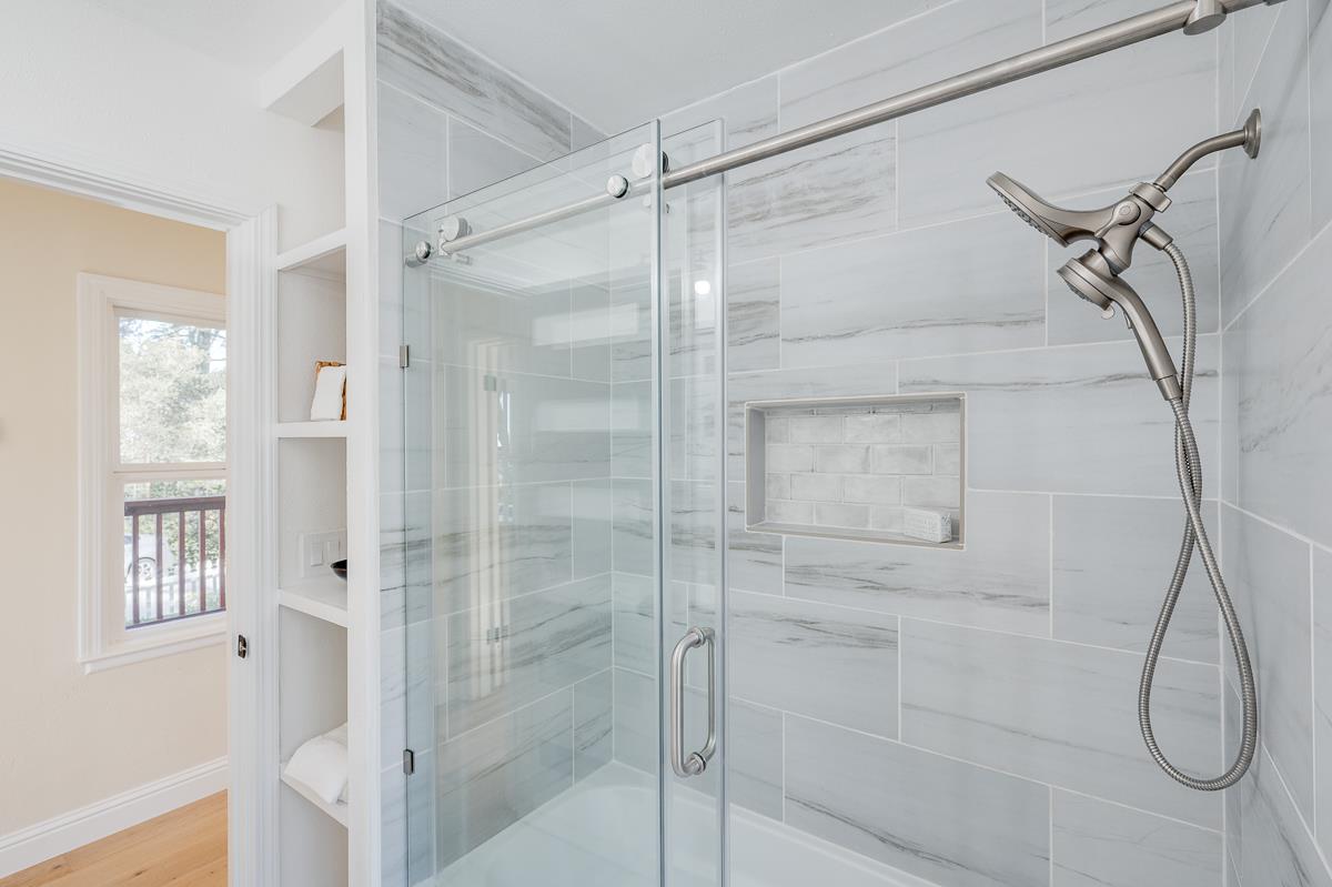 305 Stuart Avenue Pacific Grove, CA 93950 - Photo 39 of 55 a bathroom with a glass shower door