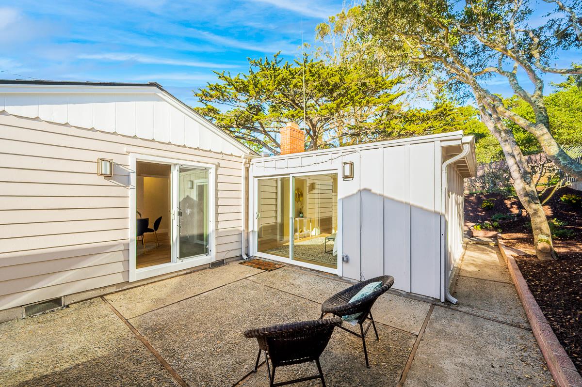 305 Stuart Avenue Pacific Grove, CA 93950 - Photo 41 of 55 a view of a house with backyard and sitting area