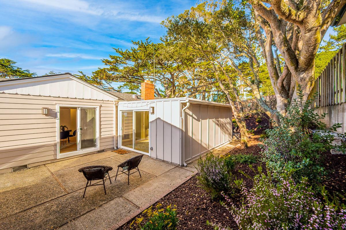 305 Stuart Avenue Pacific Grove, CA 93950 - Photo 45 of 55 a view of a house with backyard and sitting area