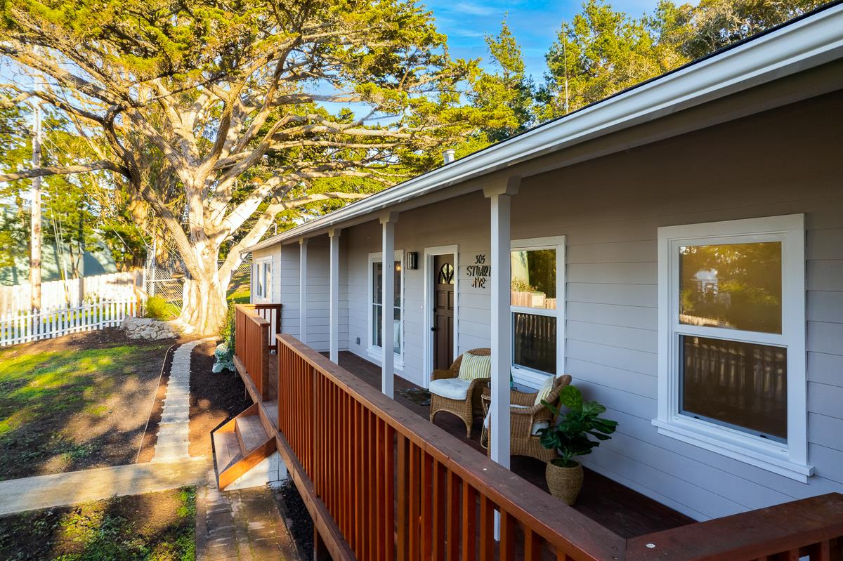 305 Stuart Avenue Pacific Grove, CA 93950 - Photo 8 of 55 a view of a house with backyard and trees