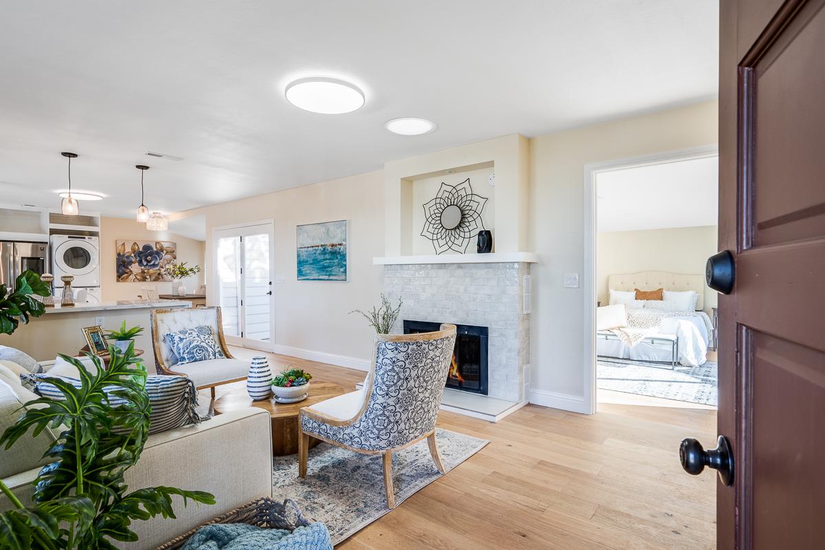 305 Stuart Avenue Pacific Grove, CA 93950 - Photo 9 of 55 a living room with furniture and a fireplace