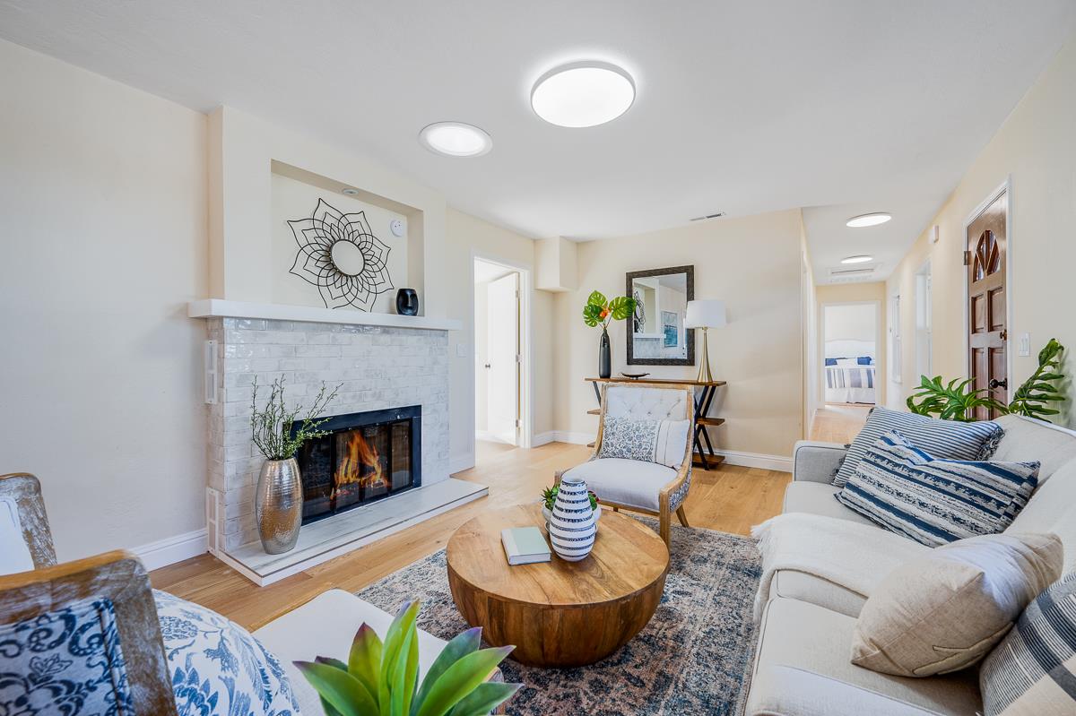 305 Stuart Avenue Pacific Grove, CA 93950 - Photo 10 of 55 a living room with furniture and a fireplace