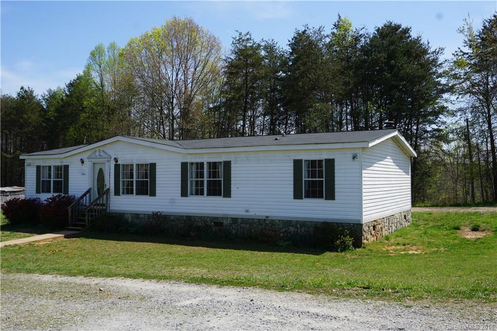1042 Elliott Road Rutherfordton, NC 28139 - Photo 13 of 33 a front view of a house with garden