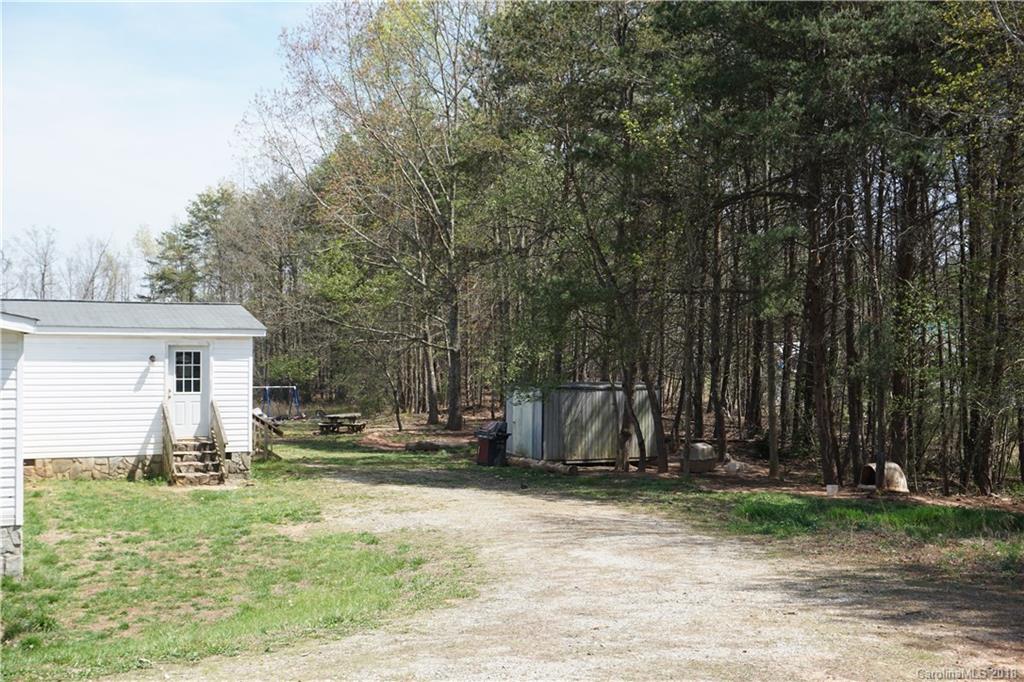 1042 Elliott Road Rutherfordton, NC 28139 - Photo 15 of 33 a front view of a house with garden