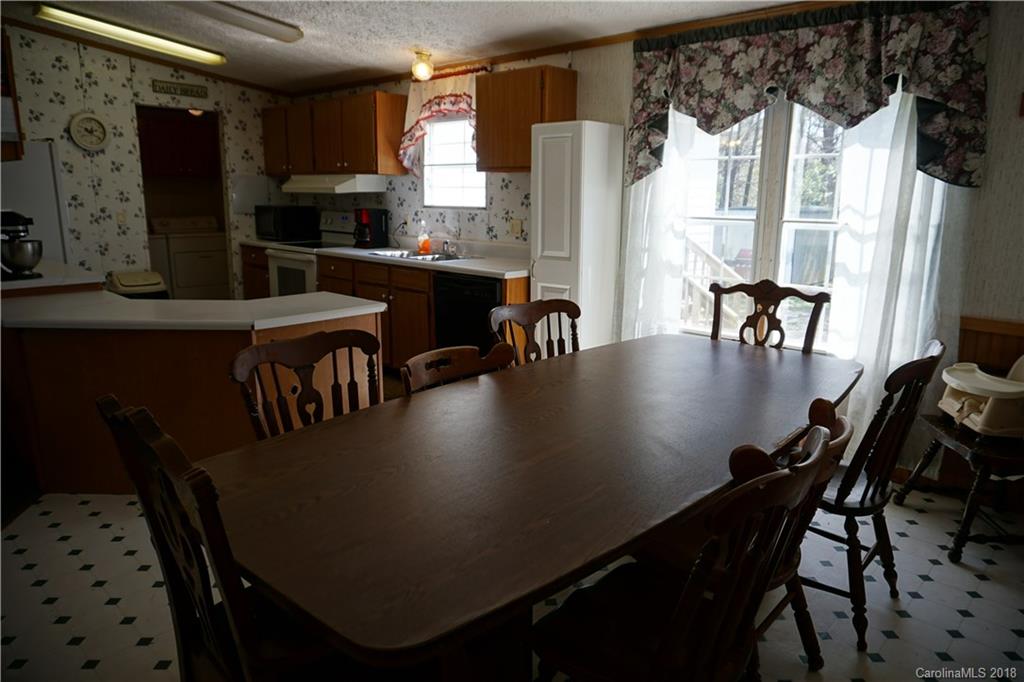 1042 Elliott Road Rutherfordton, NC 28139 - Photo 23 of 33 a view of a dining room with furniture and window