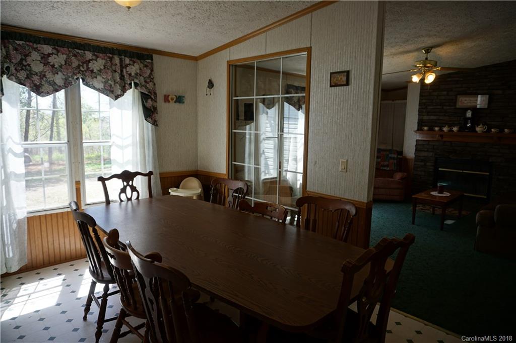 1042 Elliott Road Rutherfordton, NC 28139 - Photo 24 of 33 a view of a dining room with furniture and window