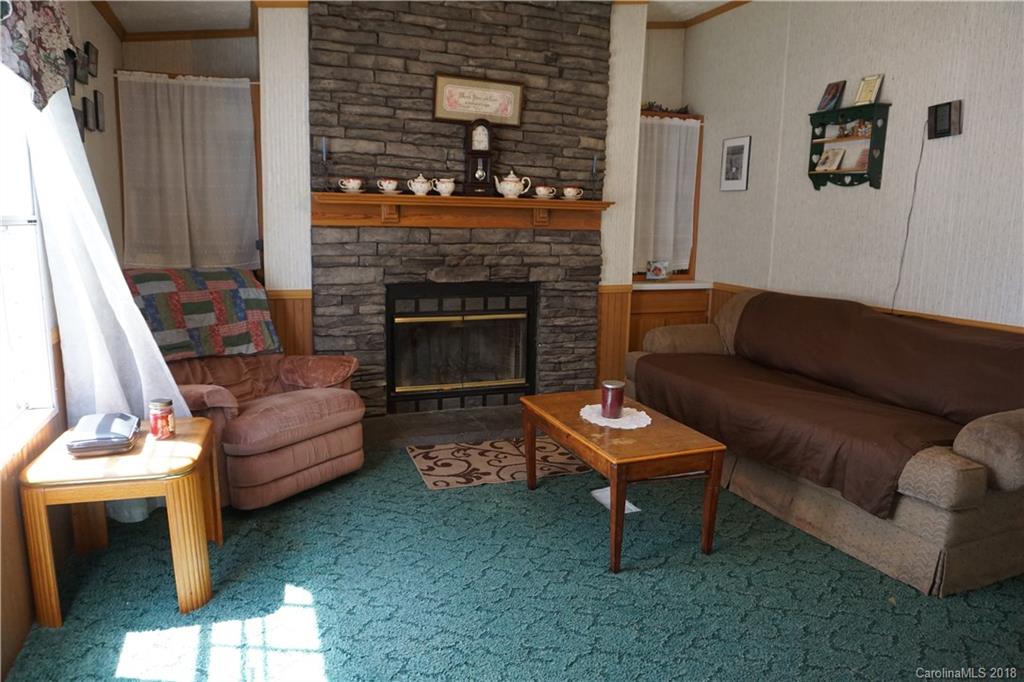 1042 Elliott Road Rutherfordton, NC 28139 - Photo 26 of 33 a living room with furniture and a fireplace