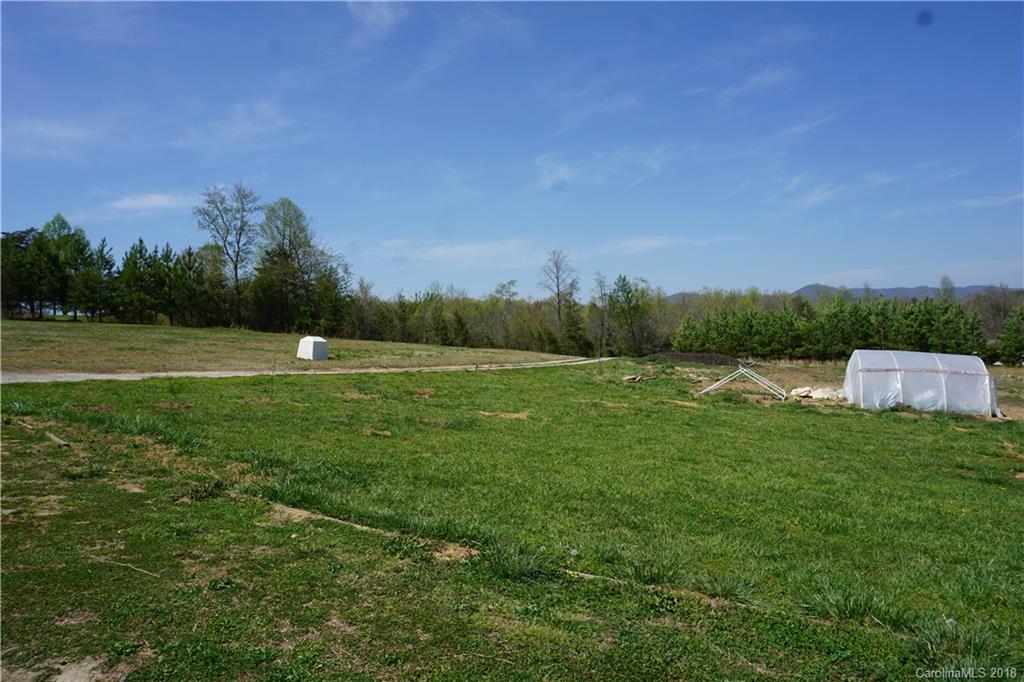 1042 Elliott Road Rutherfordton, NC 28139 - Photo 6 of 33 a view of a field of grass and trees