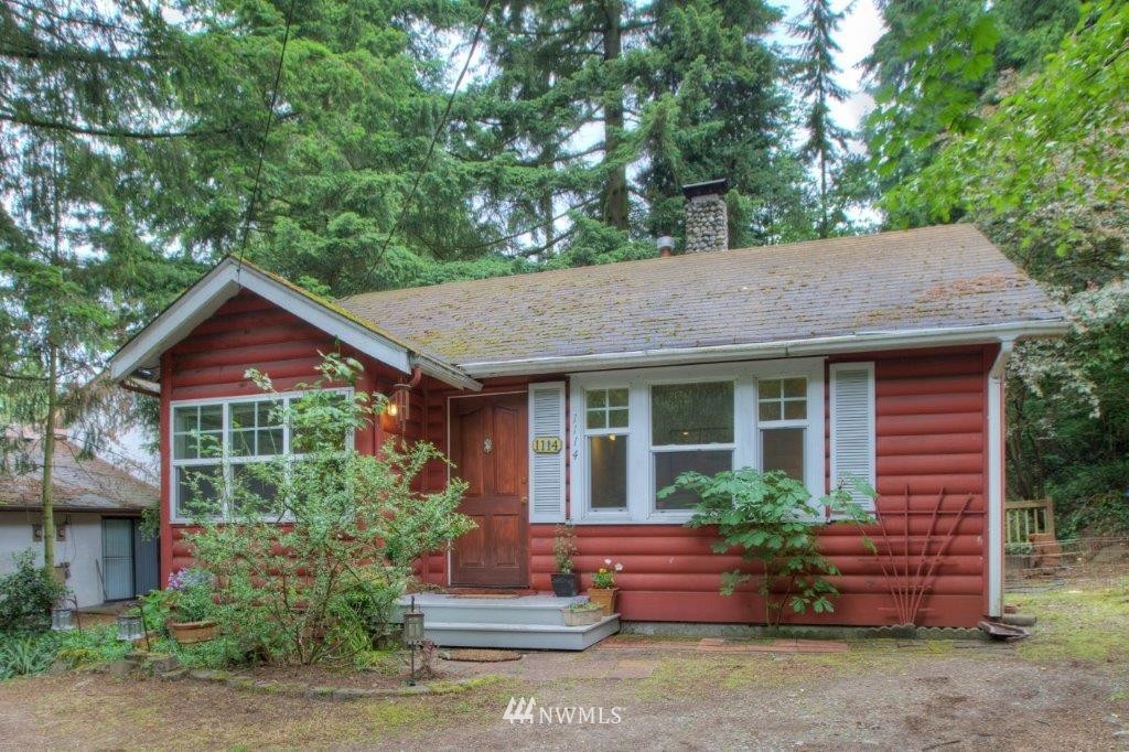 1114 Northeast 145th Street Shoreline, WA 98155 - Photo 1 of 19 a front view of a house with a yard