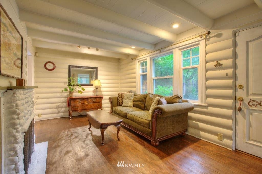 1114 Northeast 145th Street Shoreline, WA 98155 - Photo 4 of 19 a living room with furniture and a large window