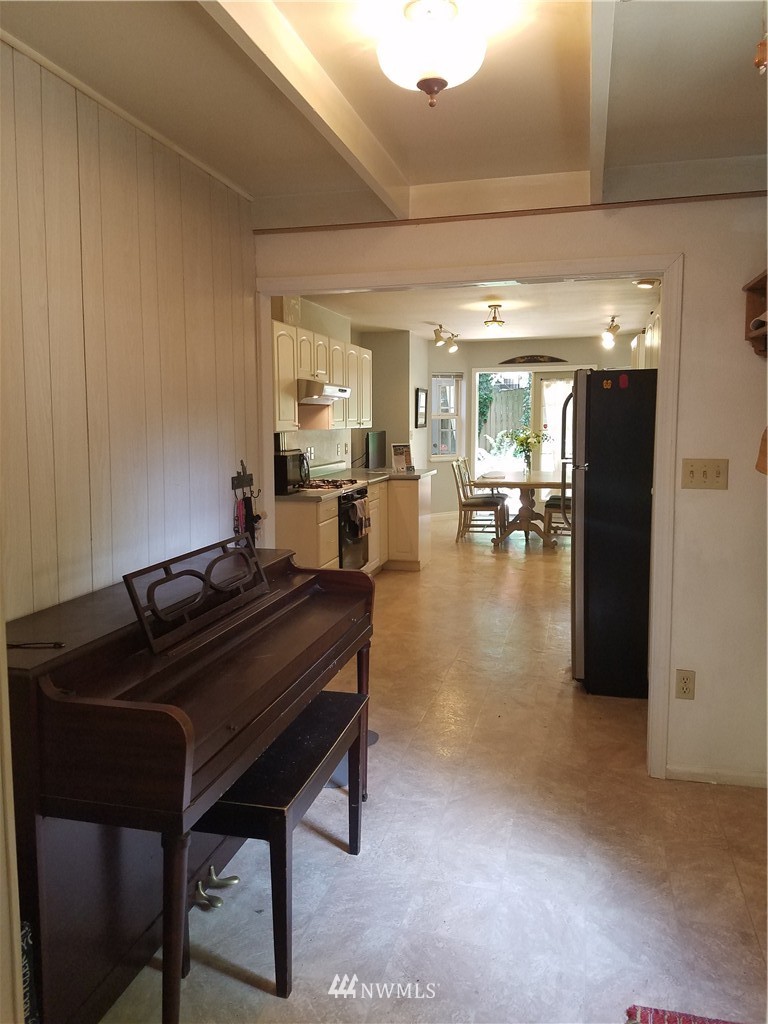 1114 Northeast 145th Street Shoreline, WA 98155 - Photo 7 of 19 a living room with furniture and a piano