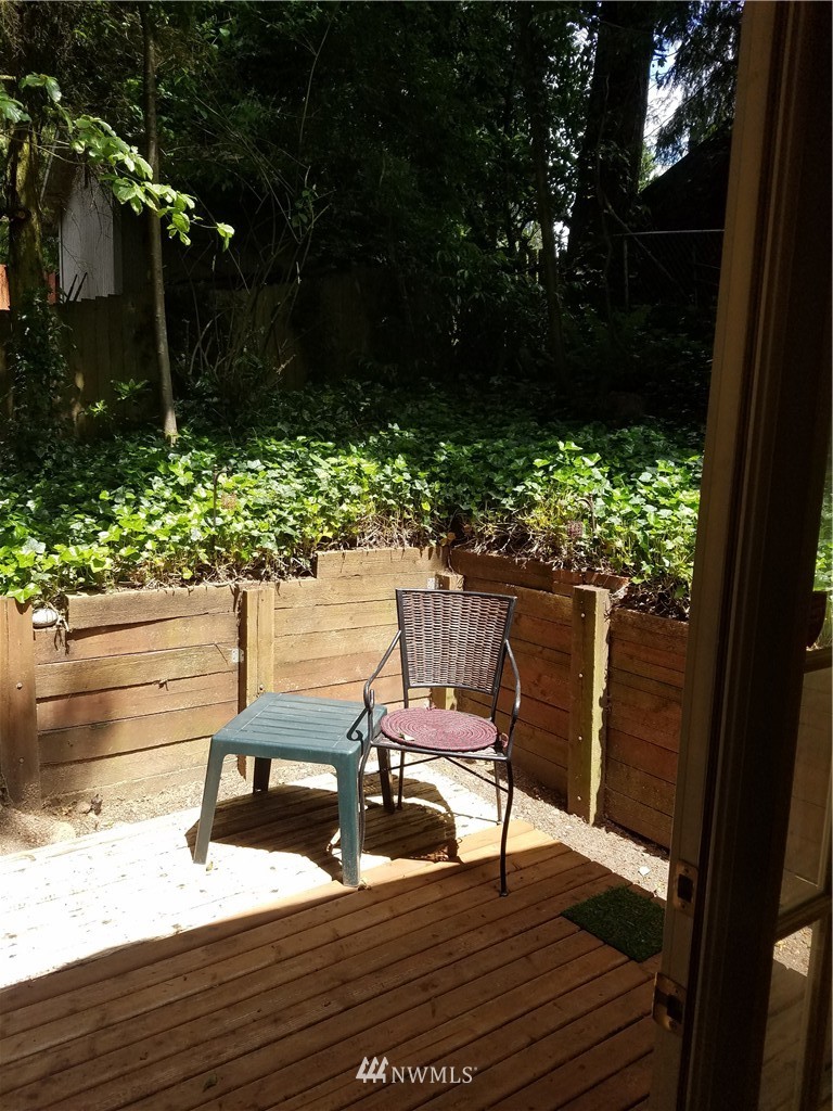 1114 Northeast 145th Street Shoreline, WA 98155 - Photo 10 of 19 a view of balcony with wooden floor and outdoor seating