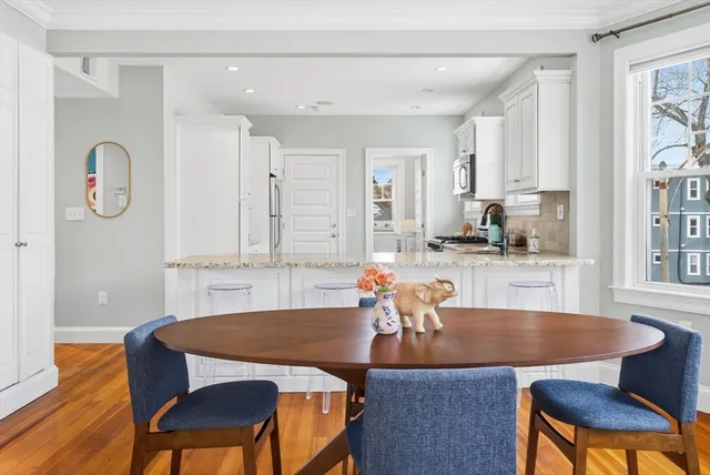 a kitchen with a refrigerator and cabinets