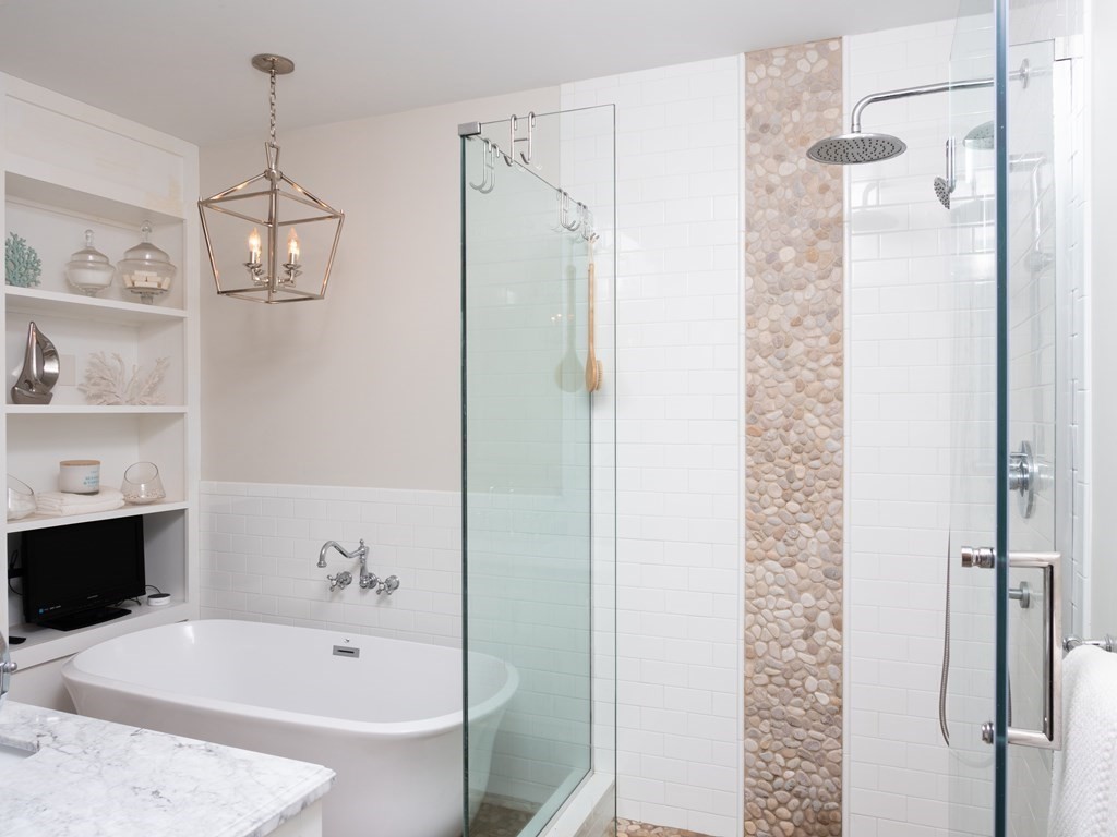 740 Reed Road Dartmouth, MA 02747 - Photo 20 of 26 a bathroom with a bathtub and a shower
