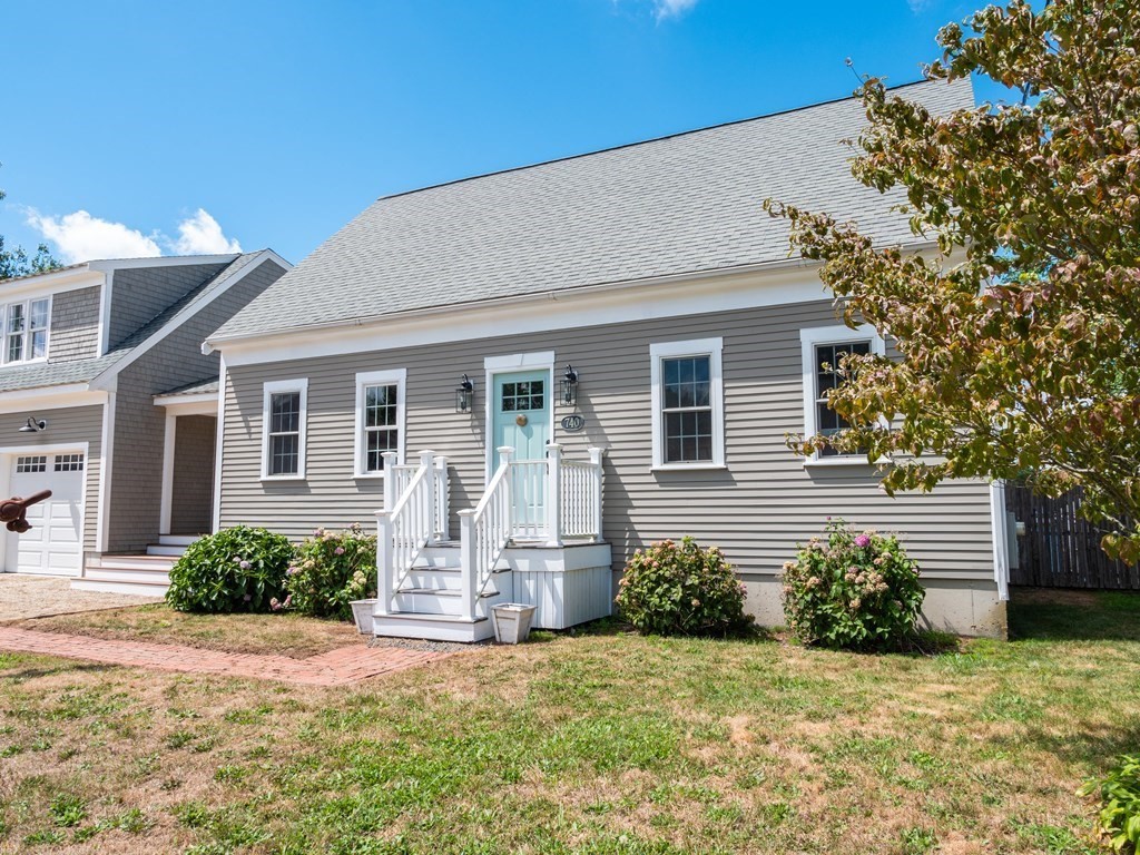740 Reed Road Dartmouth, MA 02747 - Photo 2 of 26 a front view of a house with a yard