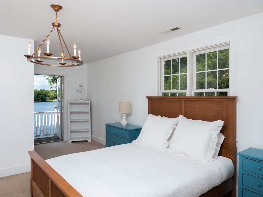 740 Reed Road Dartmouth, MA 02747 - Photo 21 of 26 a bedroom with a bed and a window