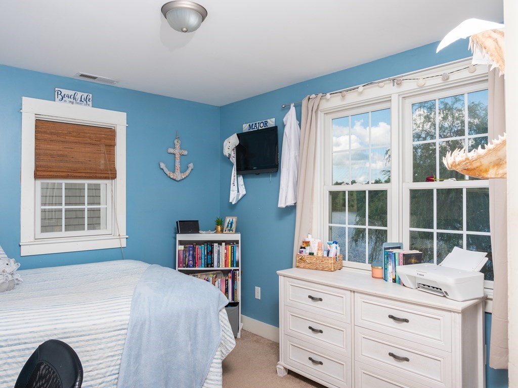 740 Reed Road Dartmouth, MA 02747 - Photo 23 of 26 a bedroom with a bed and a large window