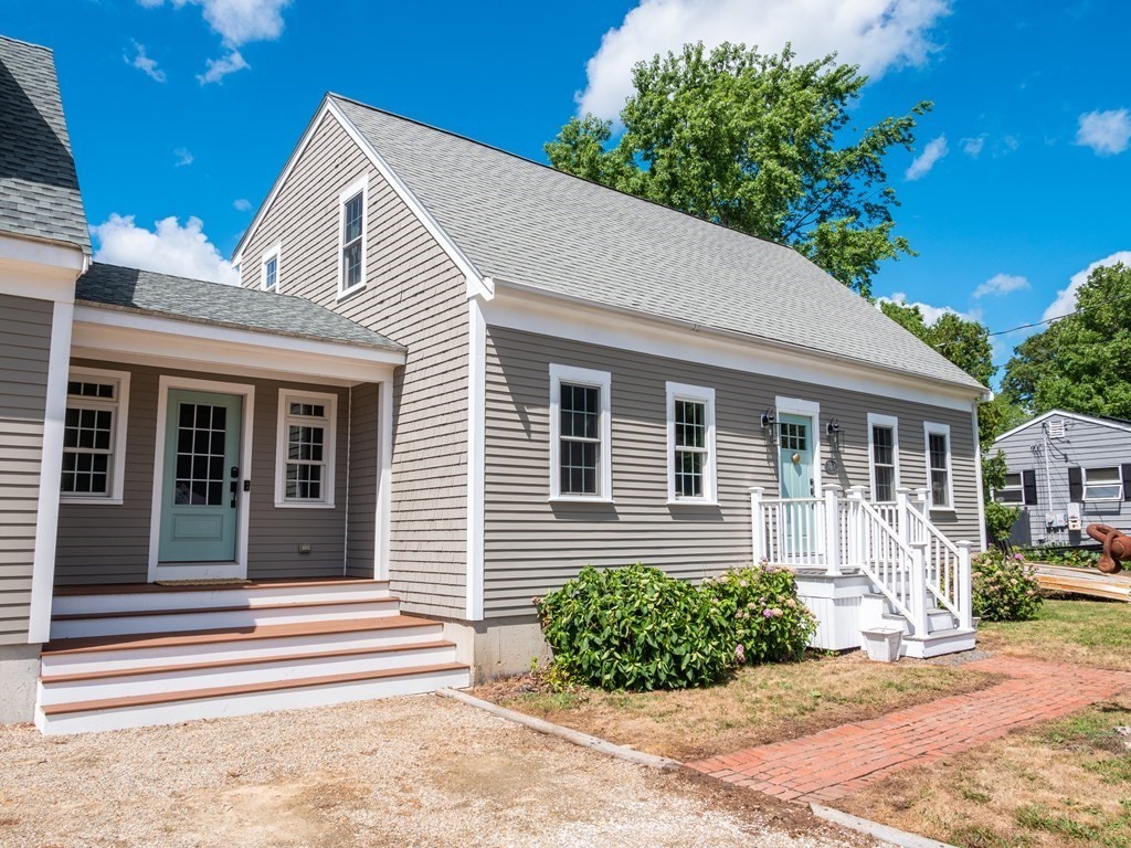 740 Reed Road Dartmouth, MA 02747 - Photo 3 of 26 a front view of a house with garden
