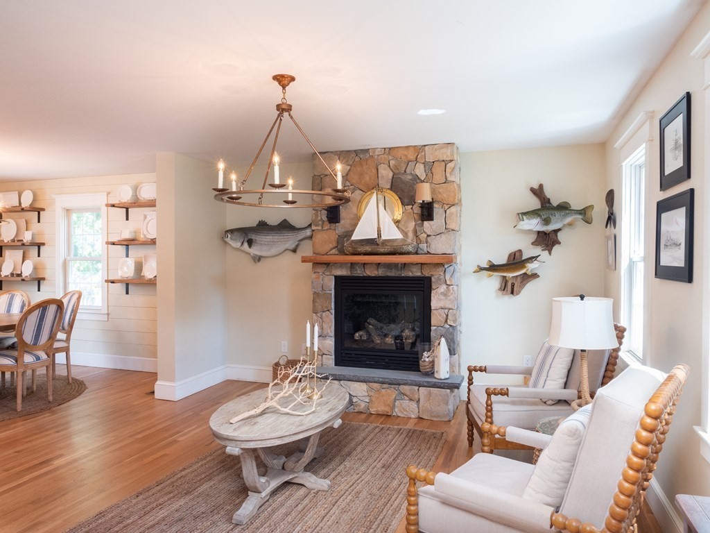 740 Reed Road Dartmouth, MA 02747 - Photo 7 of 26 a living room with furniture and a fireplace