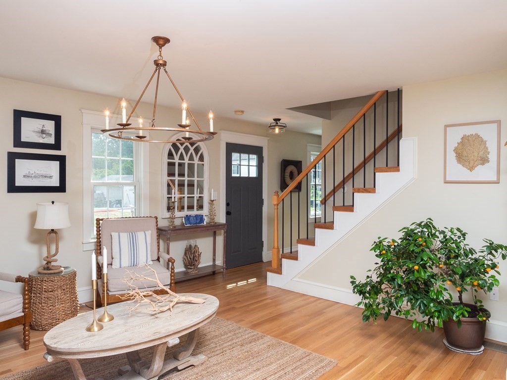 740 Reed Road Dartmouth, MA 02747 - Photo 8 of 26 a view of a livingroom with furniture window and wooden floor