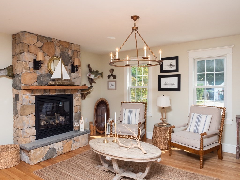 740 Reed Road Dartmouth, MA 02747 - Photo 9 of 26 a living room with furniture and a fireplace