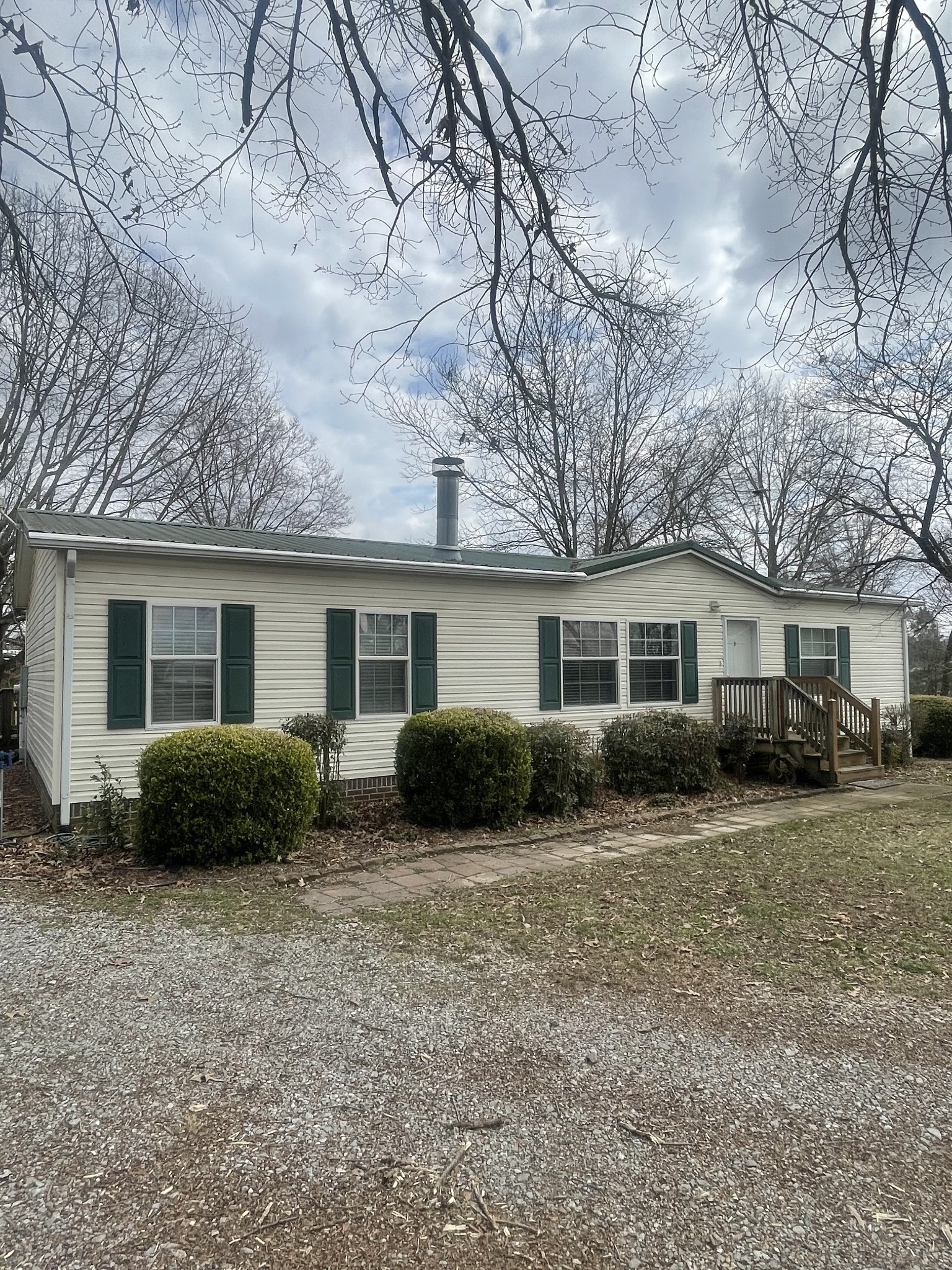 75 Snell Road Ethridge, TN 38456 - Photo 48 of 51 a view of a house with a yard covered with snow in front of it