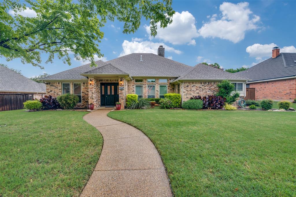 2605 Nighthawk Drive Plano, TX 75025 - Photo 1 of 1 a front view of a house with garden