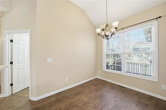 a kitchen with stainless steel appliances a stove microwave and refrigerator