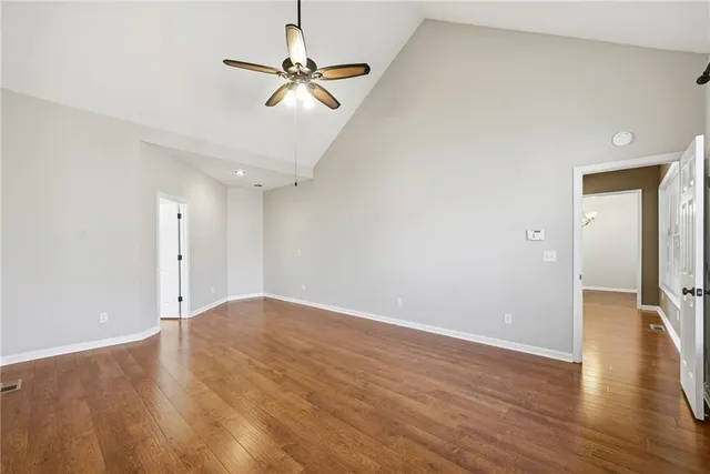a bathroom with a tub sink shower and mirror