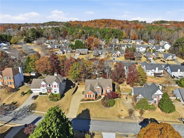 an aerial view of residential houses with outdoor space