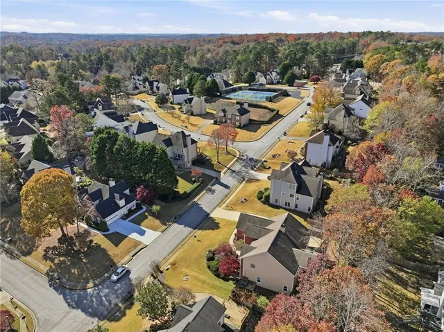 an aerial view of residential houses with outdoor space