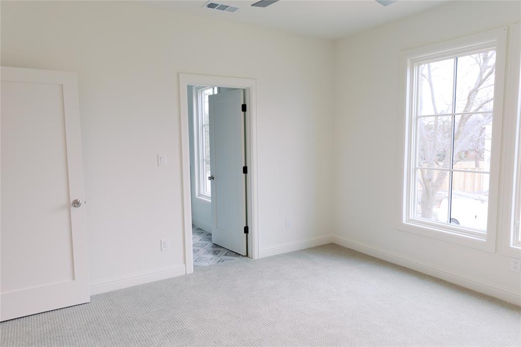 10930 Beauty Lane Dallas, TX 75229 - Photo 14 of 27 an empty room with windows and closet